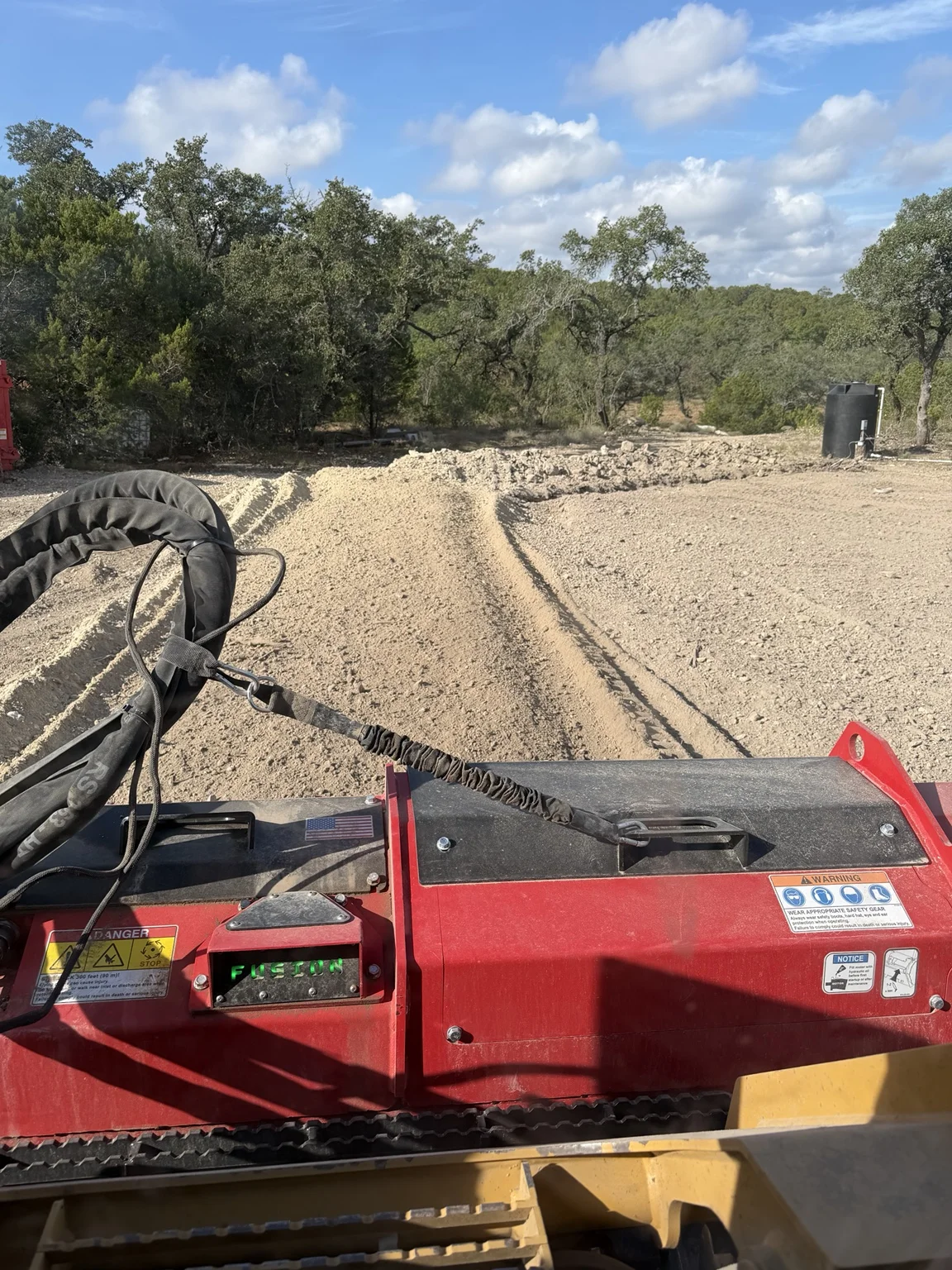 Rock milling attachment and freshly worked ground on a Terrain Land Services project